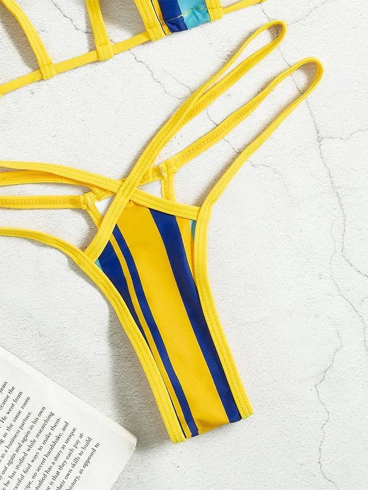 Yellow women's swimsuit with split skirt and hollow backless design.