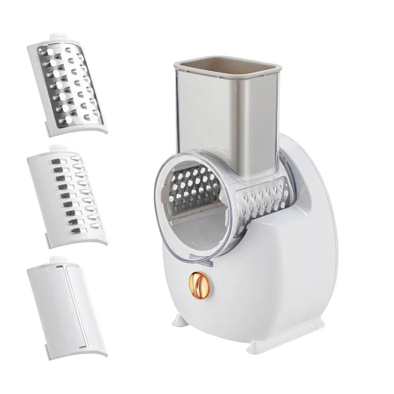 White electric vegetable slicer with rotary grater, suction base, and multiple blades on kitchen counter