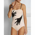 Women's solid-colour one-piece bikini swimsuit with optional gauze skirt.