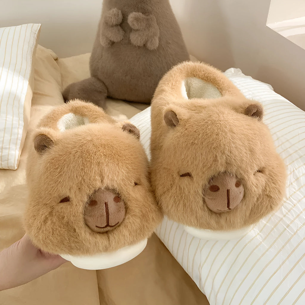 Light brown women's plush winter slippers with cartoon pattern and oversleeve design.