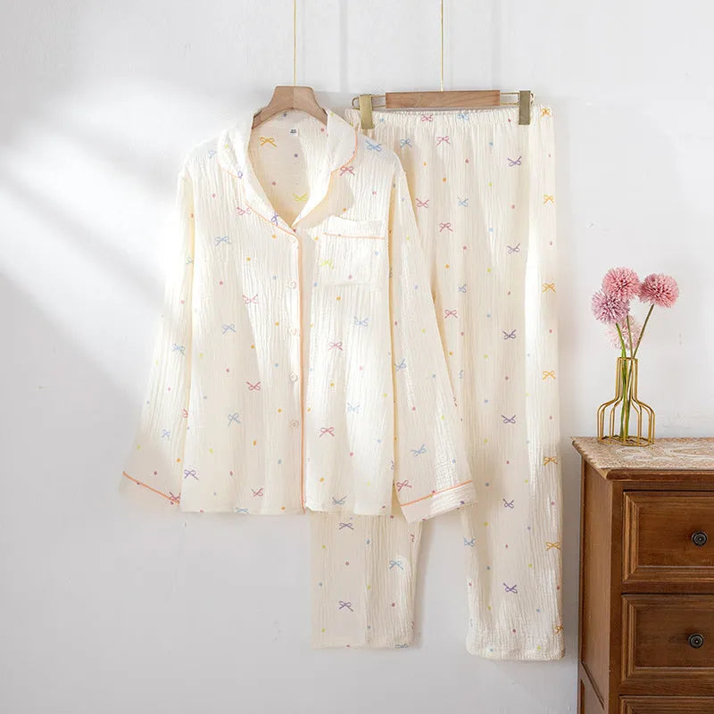 Women's beige cotton pajama suit with long sleeves and trousers for homewear.