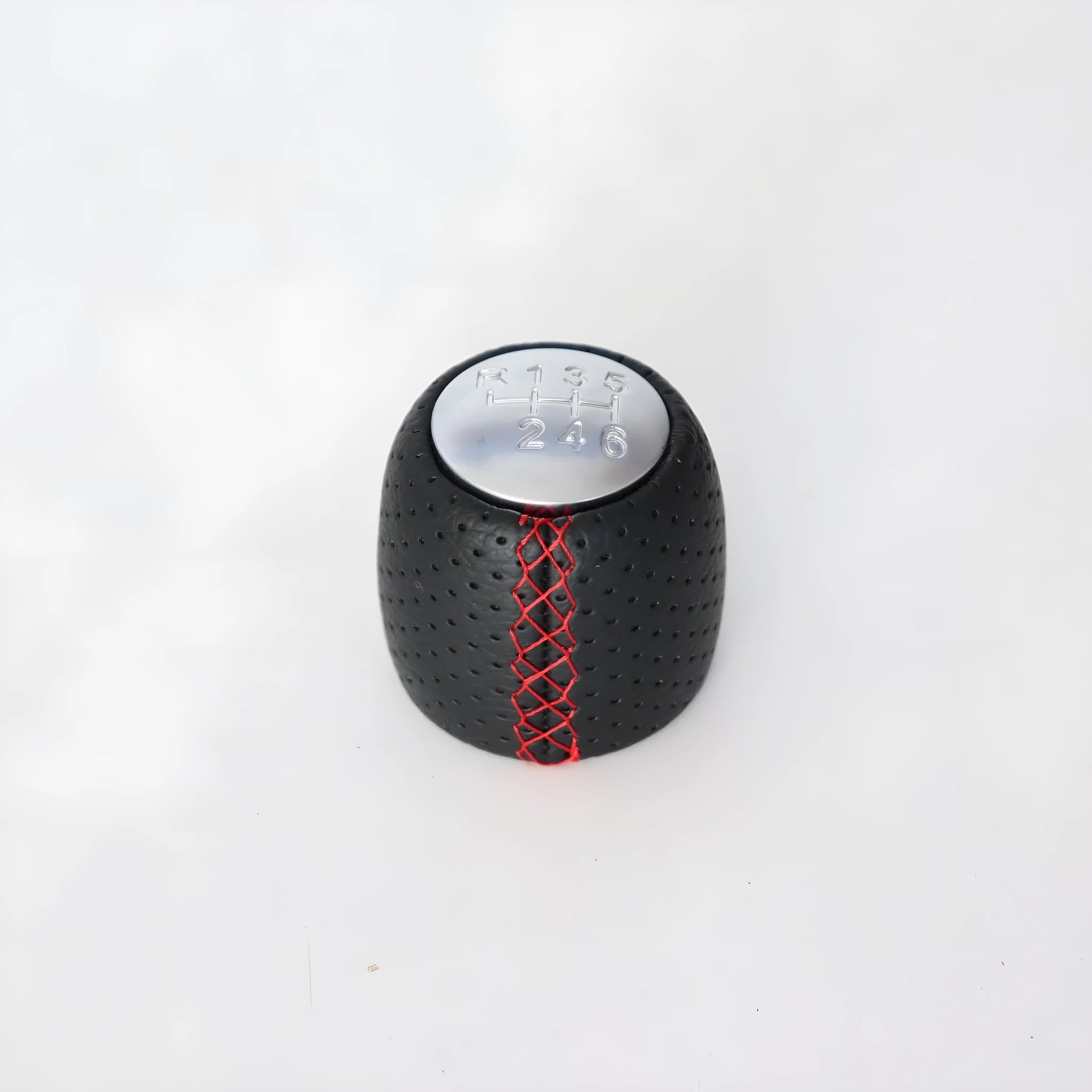 Black leather handball gear with perforations for Alpha car, shown with silver and matte cover options.