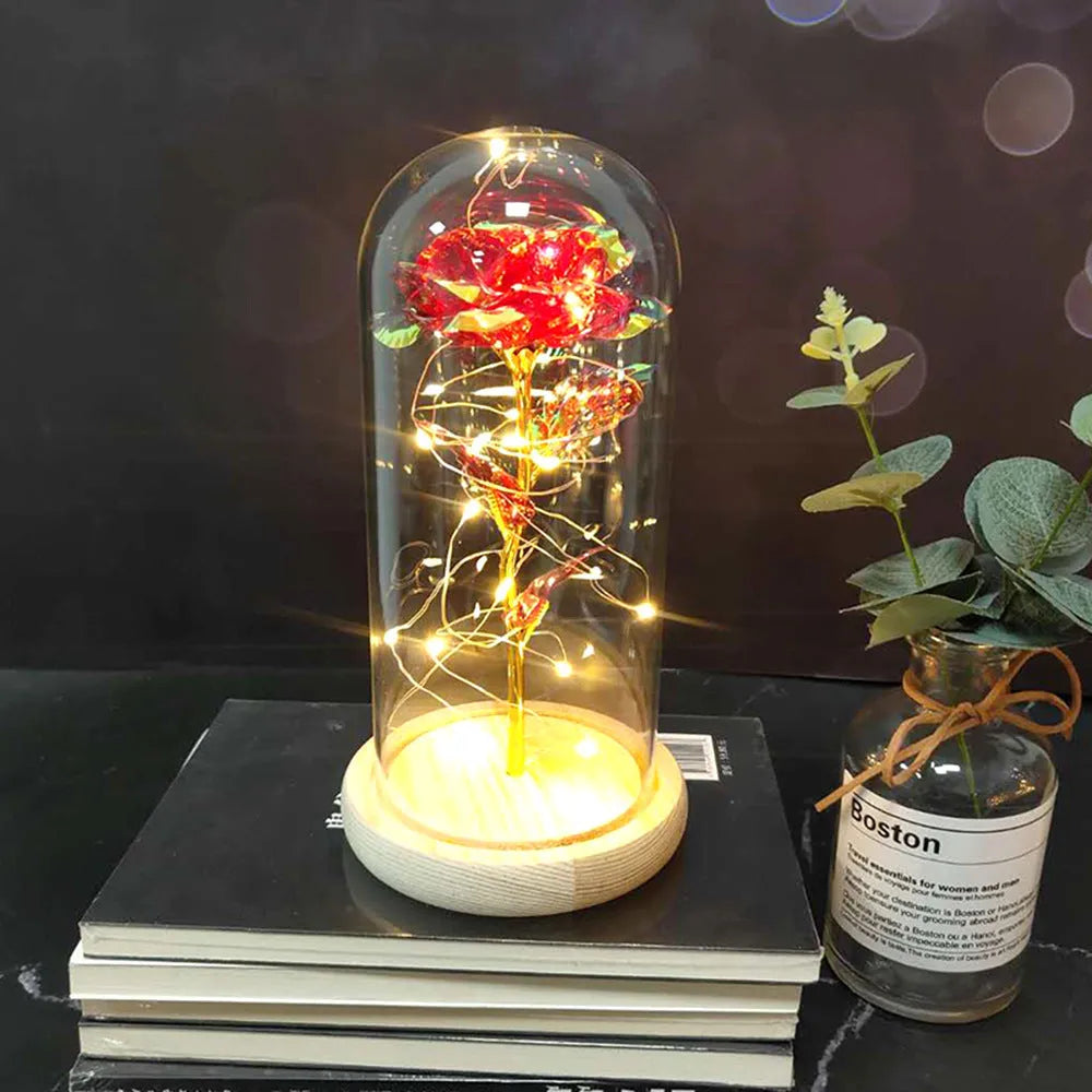 Silk rose bouquet with LED lights and glass shade in scarlet colour on wooden base