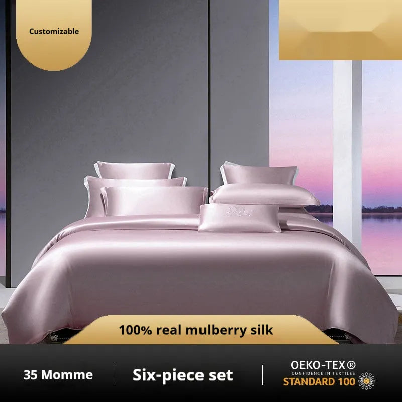 Silk four-piece quilt cover set in a solid colour, shown in a bedroom setting on a bed.
