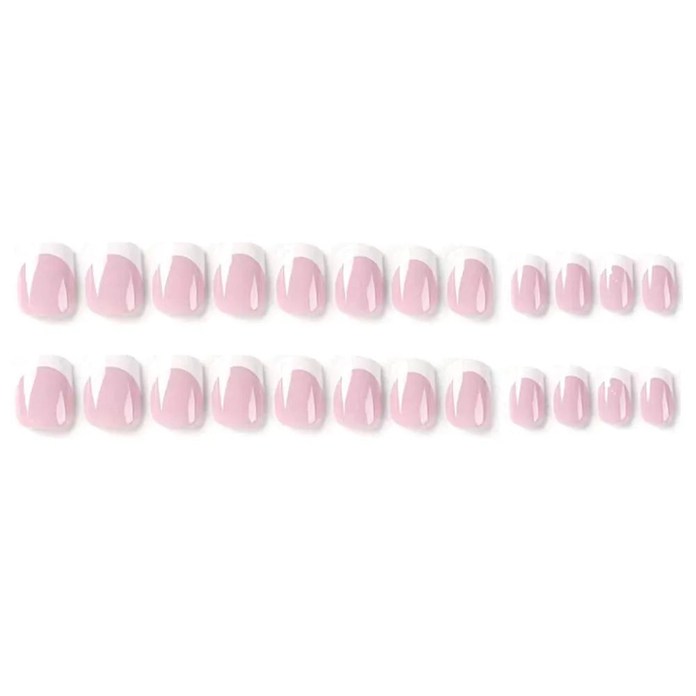 24 white plaid-pattern false nail tips laid out on a surface