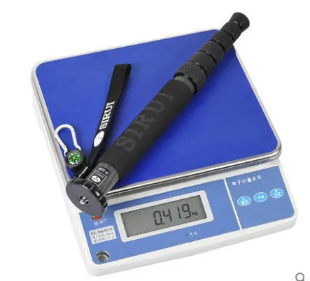 Black carbon fibre monopod for SLR cameras extended to maximum height showing 6 sections