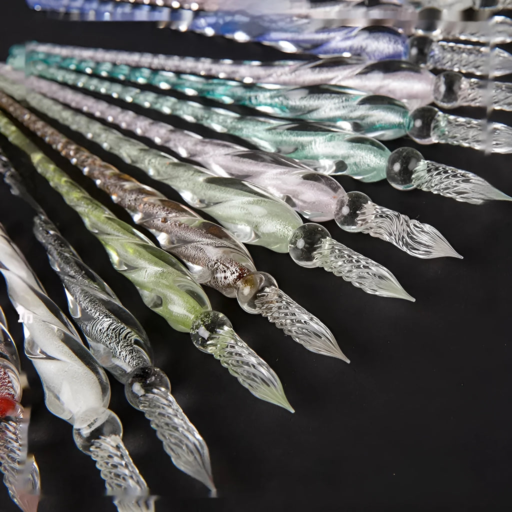 Transparent glass signature pen with coloured ink visible inside, abstract modelling, gift box packaging