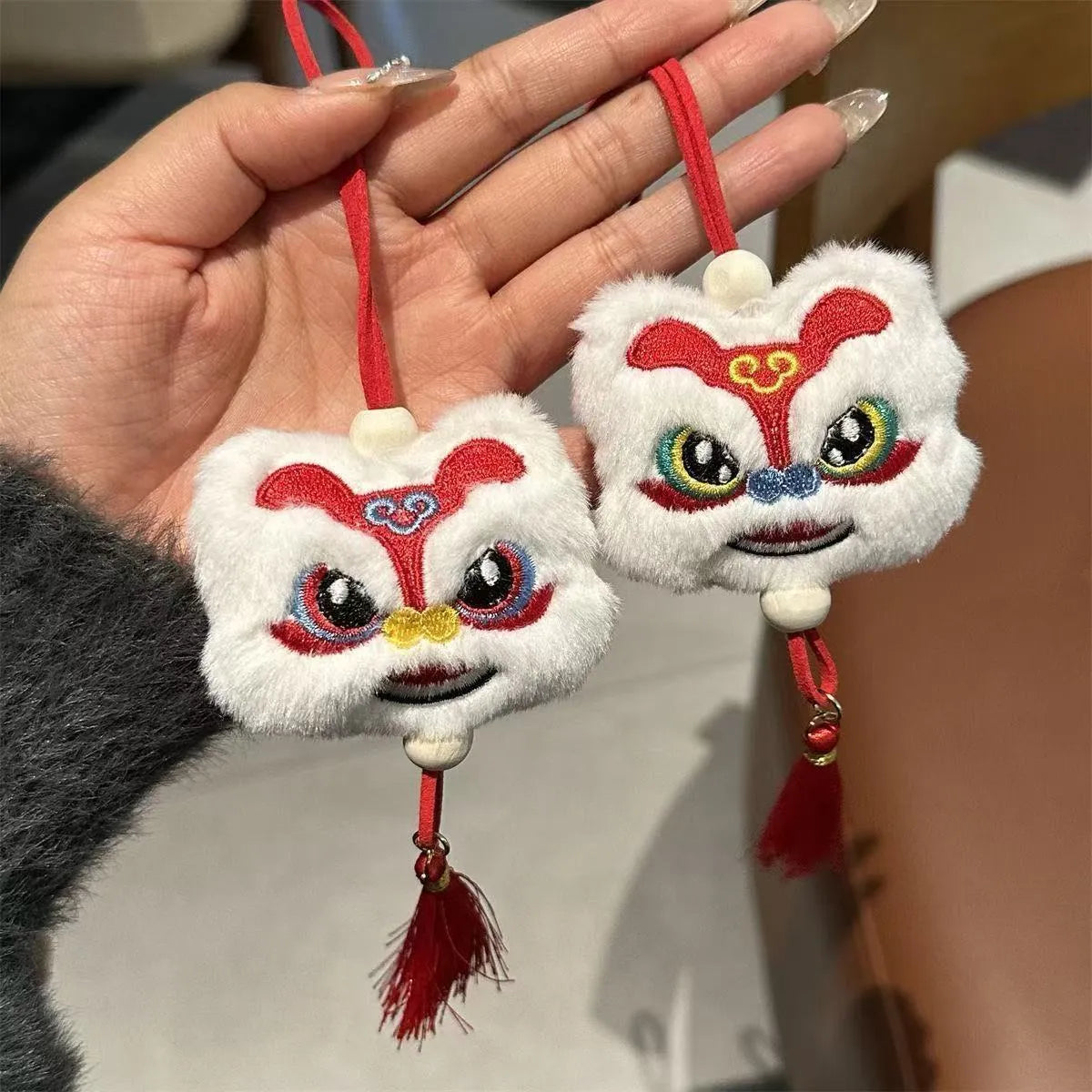 Chinese style plush lion keychain ornament with star stone details in blue or yellow colour
