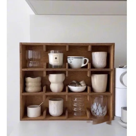 Square solid wood cup storage rack with birch finish and multiple square compartments for organising mugs.