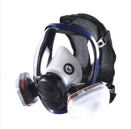 Gas mask with activated carbon canister and spherical silicone facepiece showing trapezoidal filter design