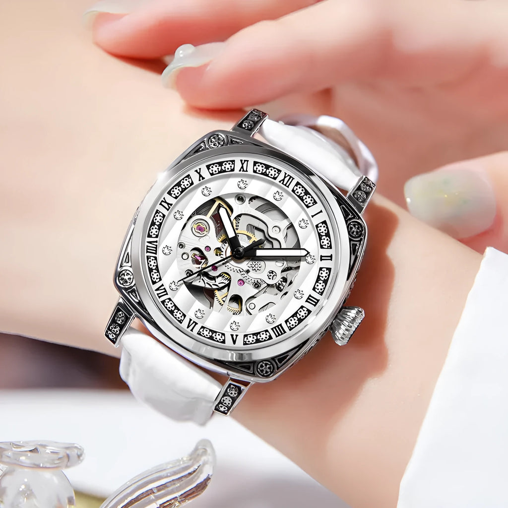 Leather strap mechanical watch with luminous hands showing black, red, steel strip and white colour options