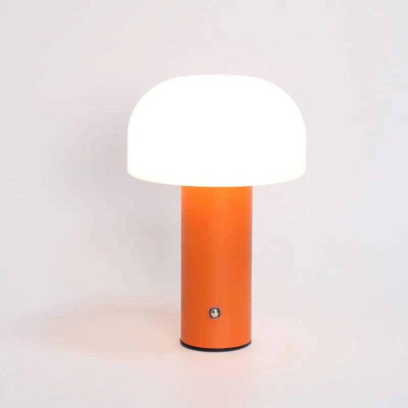 A USB-powered decorative table lamp in a choice of white, black, orange, or green colours.