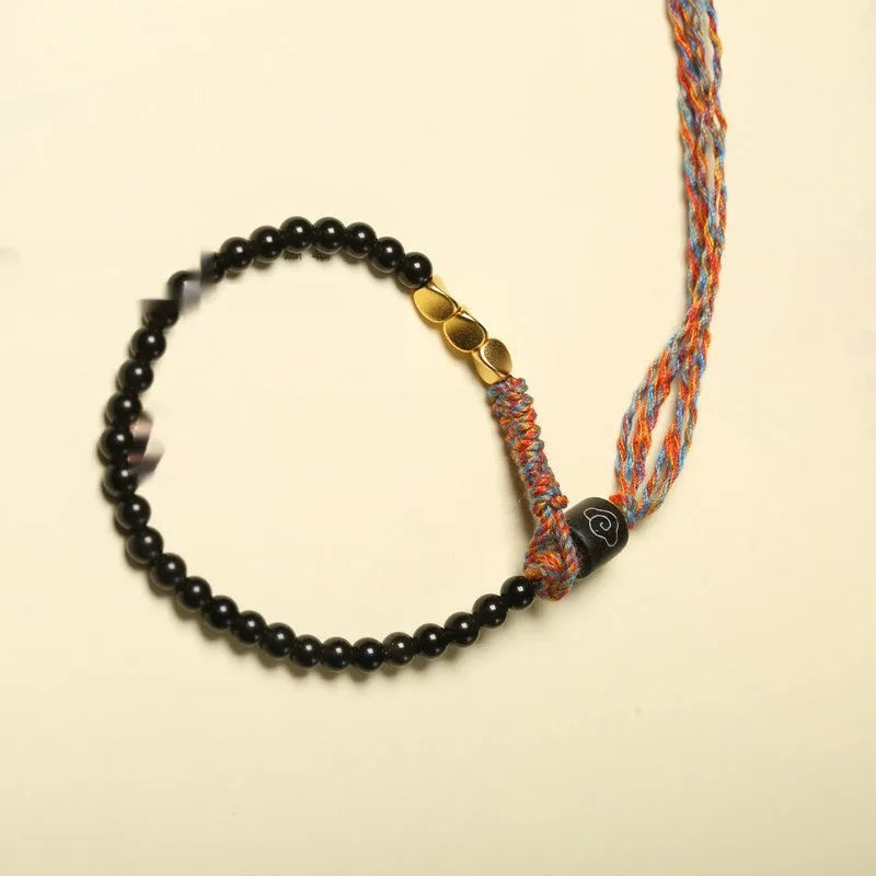 Hand-woven obsidian bracelet strap showing textured detail and 4mm width