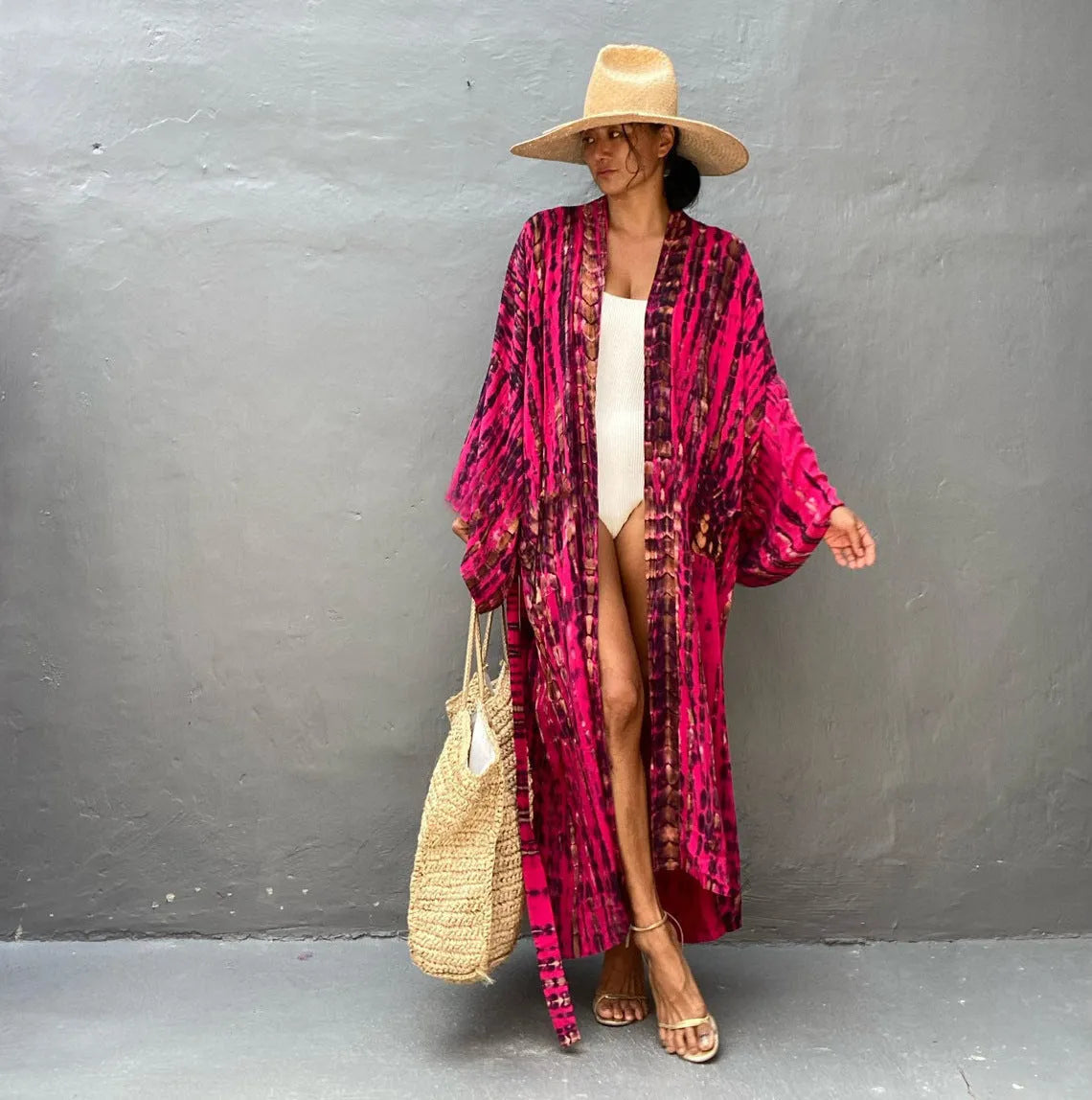 Woman wearing a printed cotton beach cover-up blouse in a DN0712 series colour.