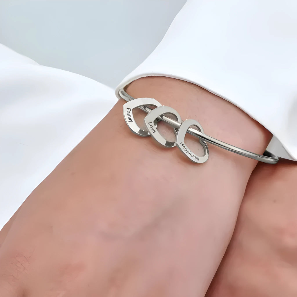 Love bracelet with peach heart charm and name lettering in stainless steel, silver colour