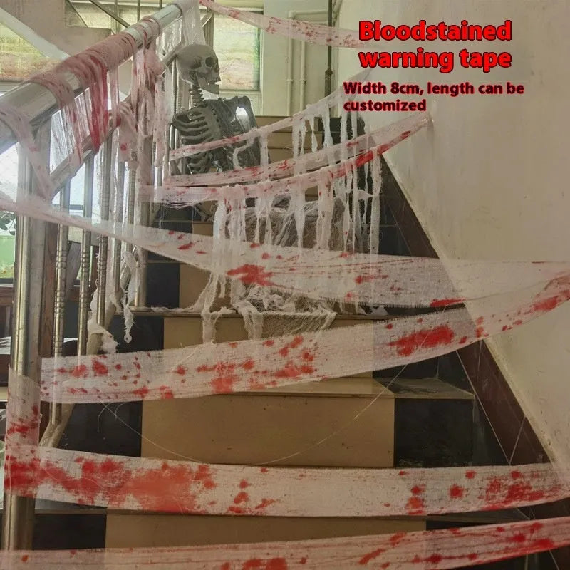Roll of Halloween horror dyed gauze bandage in bloody red colour, shown with a loose end draped.