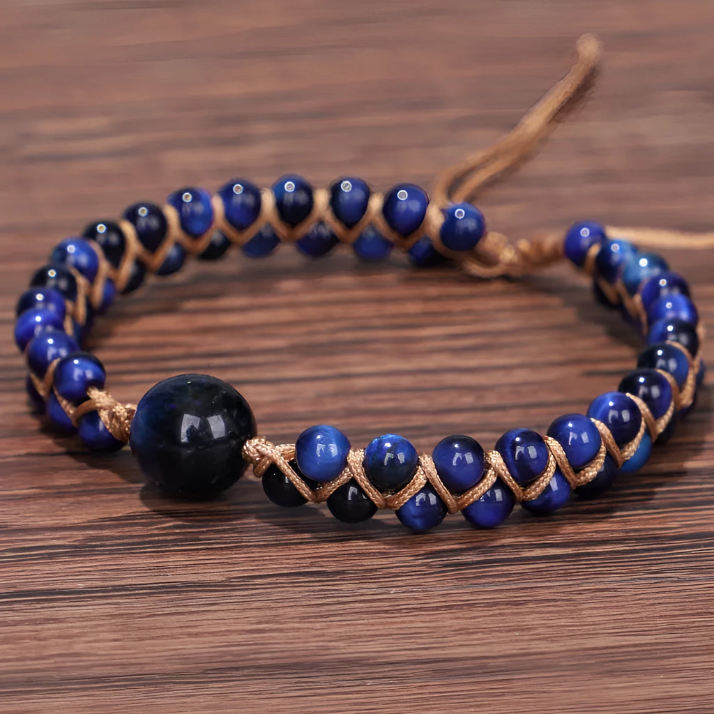 Handmade woven geometric pull bracelet in blue tigereye stone with adjustable closure.