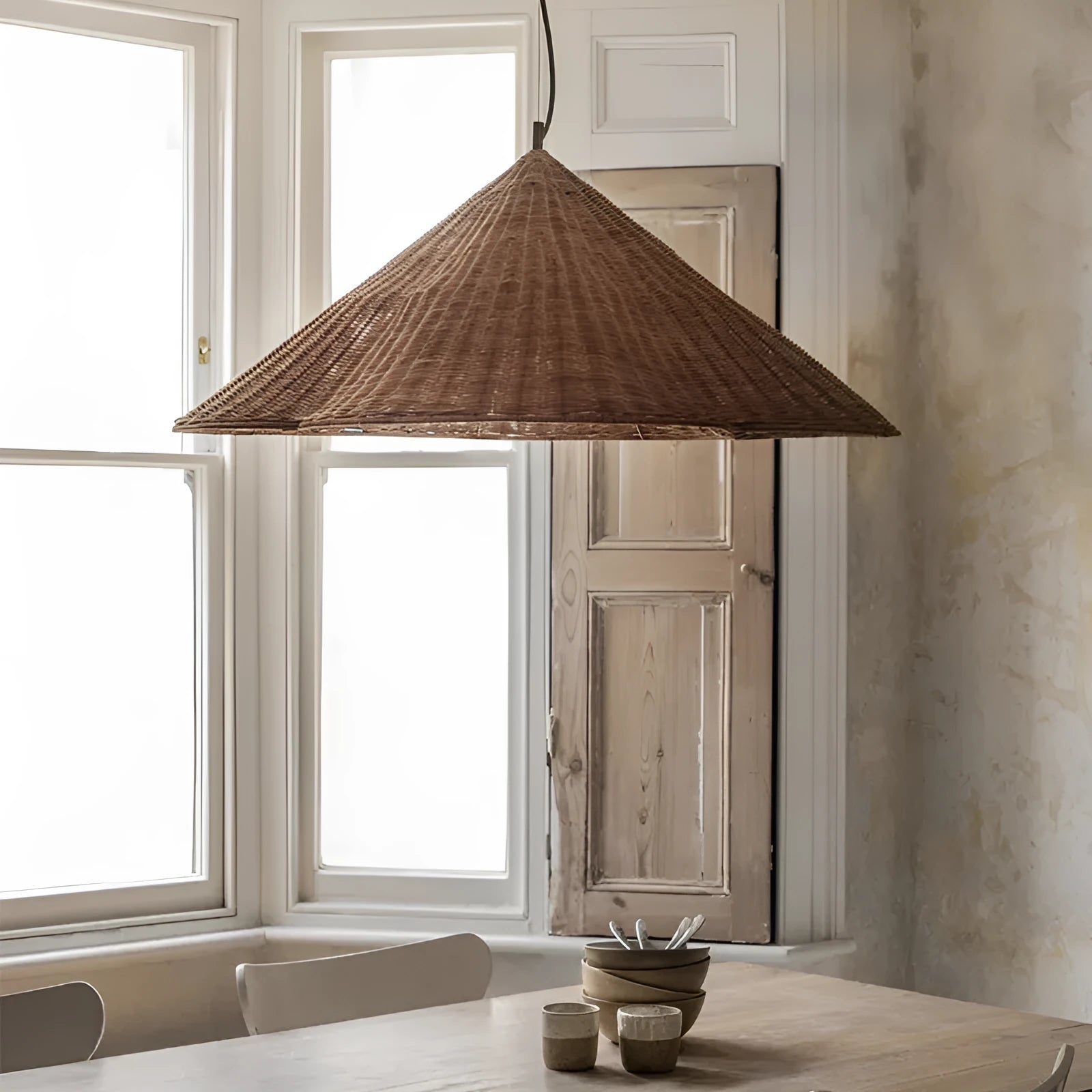 Silent Style natural rattan woven ceiling lamp with black metal trim in three diameter sizes.