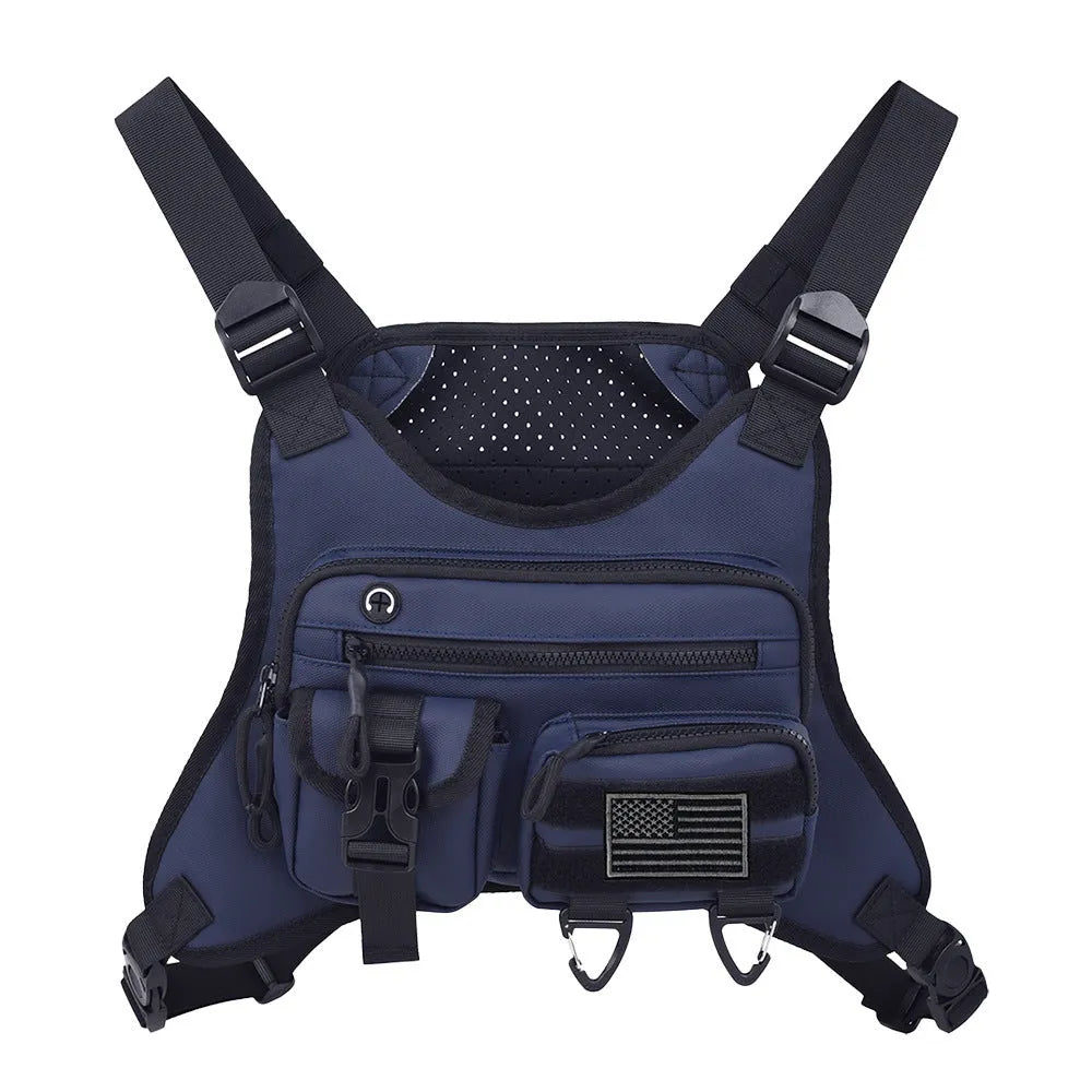Men's black Oxford cloth chest bag worn as a vest, showing sewing line details and buckle closures.