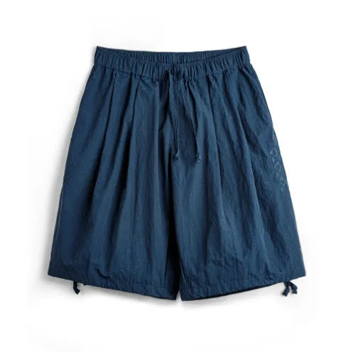 Men's Prussian blue embroidered nylon shorts with loose fit and fifth-pant length