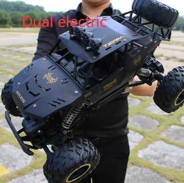 Black and silver remote control climbing cars with 2.4G wireless controller on a rough surface.