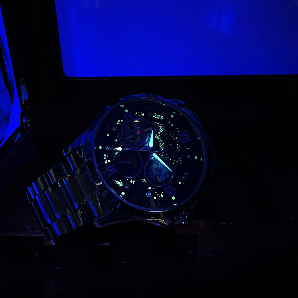 Men's automatic mechanical watch with rose gold case and black dial showing 12mm thickness