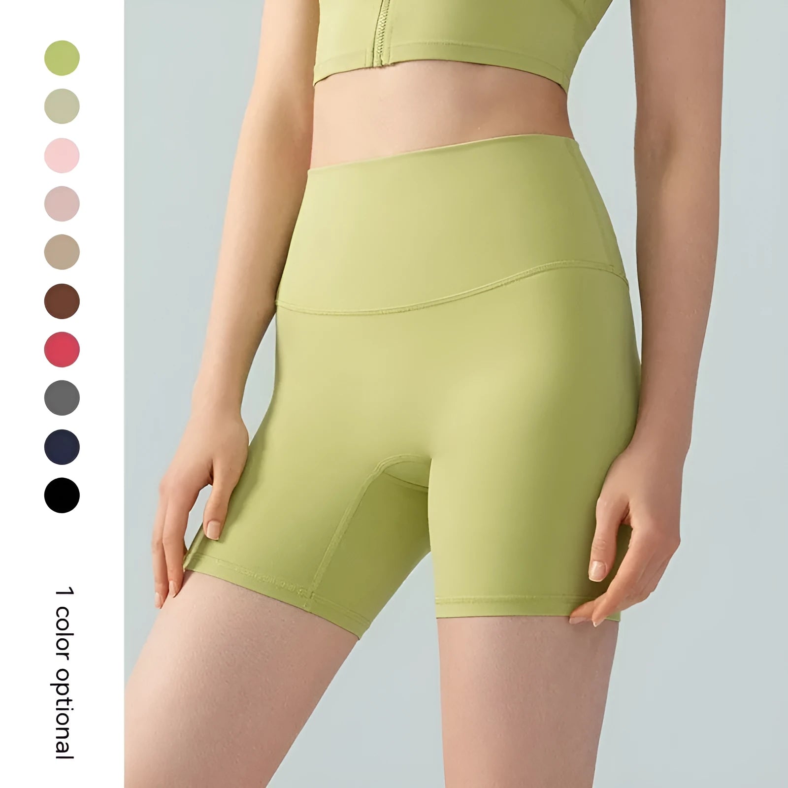 Women's high waist Lycra yoga shorts in leaf green, shown in a yoga pose.