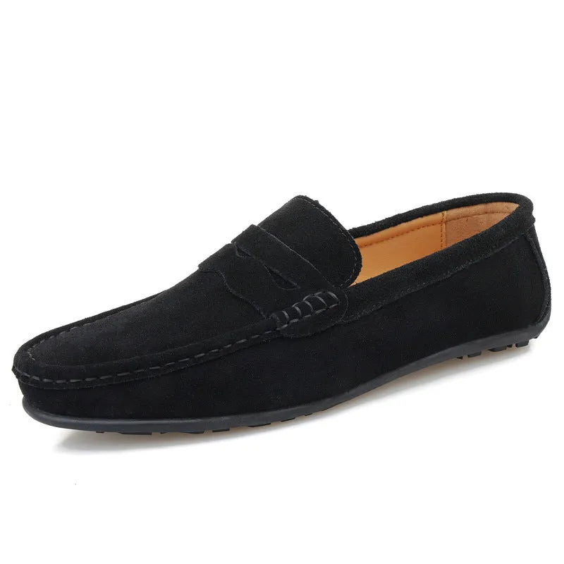 Men's solid colour suede leather slip-on loafers with a flat rubber sole.