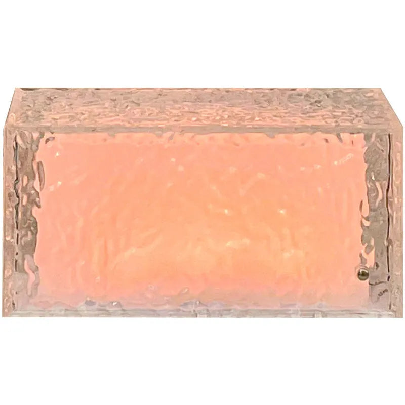 Acrylic ice cube geometric night lamp with colour changing light on bedside table