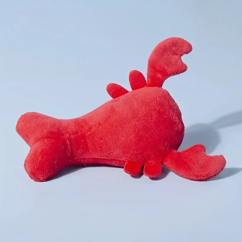 Red lobster-shaped squeaky dog toy for small and medium breeds on white background
