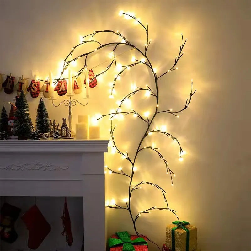 Flexible birch bark textured LED willow vine garland bent into shape with warm white lights.