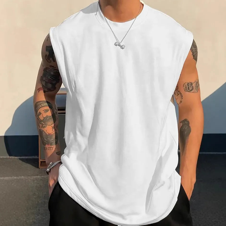 Men's loose solid colour cotton tank top sleeveless t-shirt on a hanger.