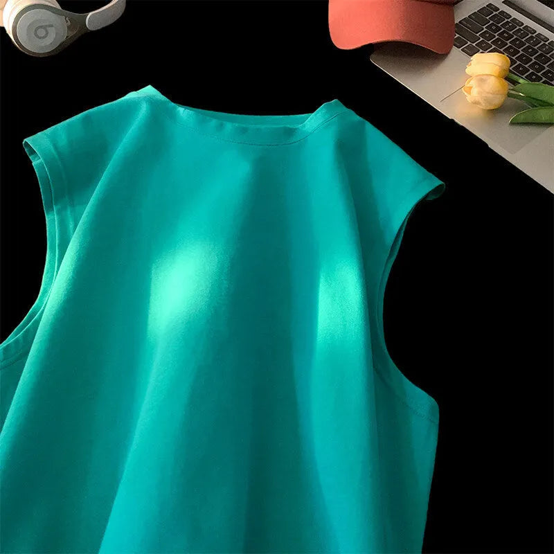 Men's loose solid colour cotton tank top sleeveless t-shirt on a hanger.