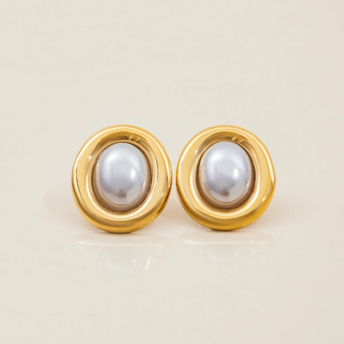 Silver vintage pearl stud earrings made from stainless steel with electroplated finish
