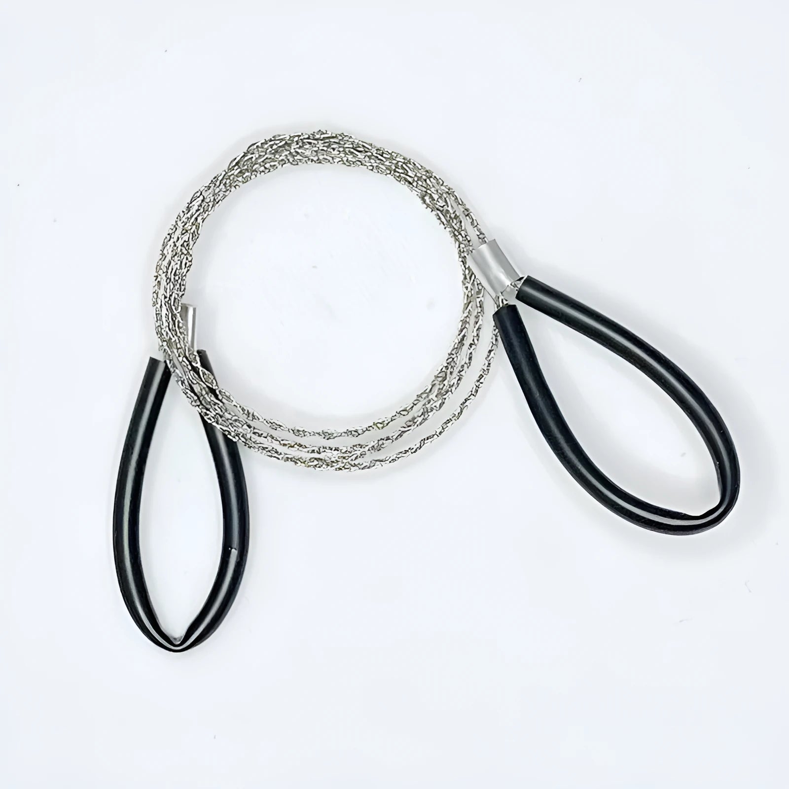 German stainless steel survival wire saw coiled up, showing its four-strand construction and compact size.