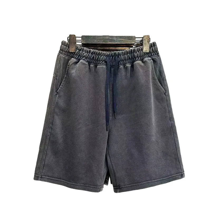 Men's cotton shorts with distressed detailing in straight-leg loose fit