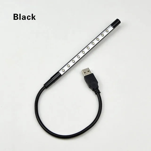 Spiral-shaped USB LED night light in metallic finish with aluminium alloy shade and metal base.
