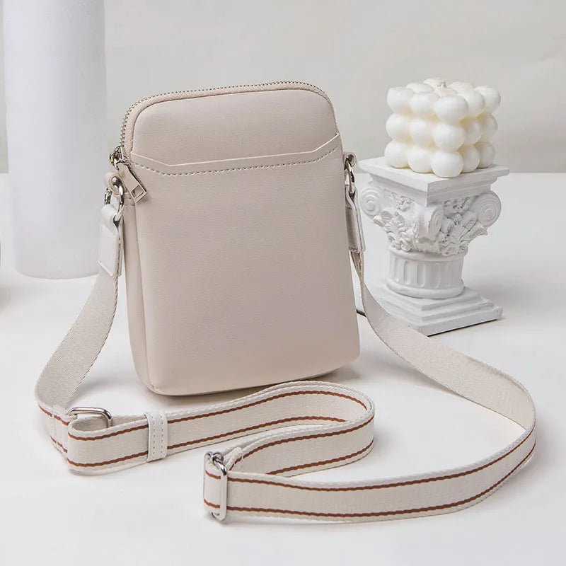 Small solid colour mobile phone crossbody bag in PU leather measuring 14.5cm wide