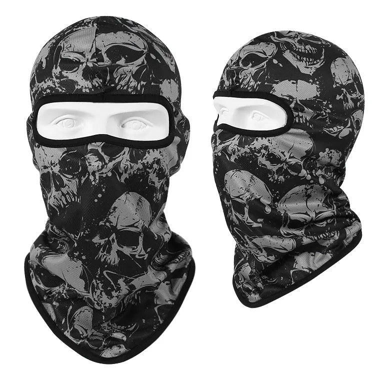 Breathable Bakool silk motorcycle skull mask in a graphic design, laid flat showing its 36cm by 29cm size.