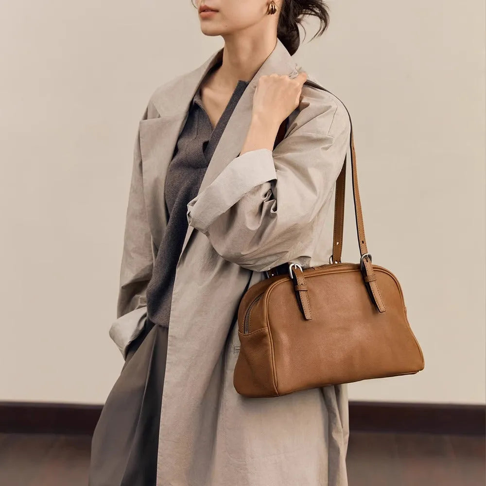 Women's genuine leather retro shoulder bag showing horizontal square design with double straps in black colour option.