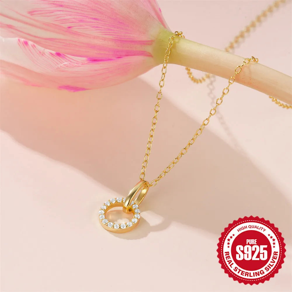 Gold coloured S925 sterling silver adjustable clavicle chain with a geometric round zircon pendant.