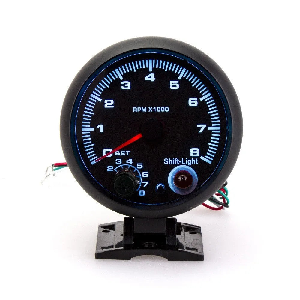 Black automotive tachometer with blue light pointer showing RPM scale 00~8×1000