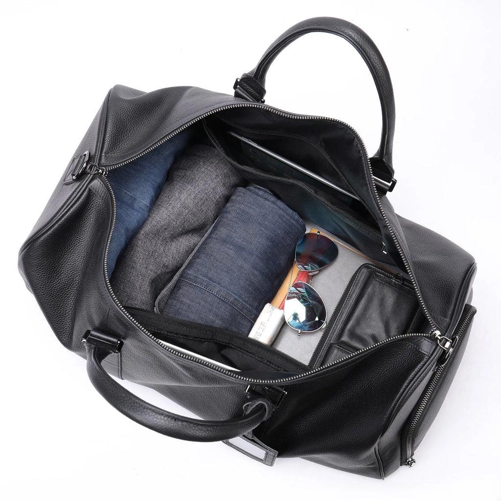 Men's black leather excursion tote bag with single shoulder strap shown at 55cm length