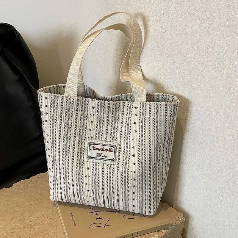 Japanese style large corduroy shoulder bag in dark brown colour showing textured fabric and casual design.