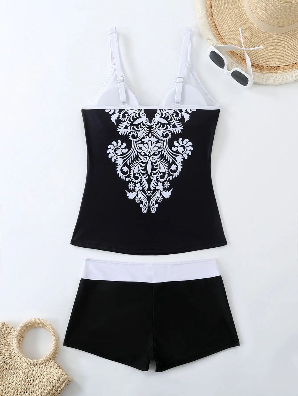 Plus size women's printed swimsuit briefs in black or rose red with matching trunks.