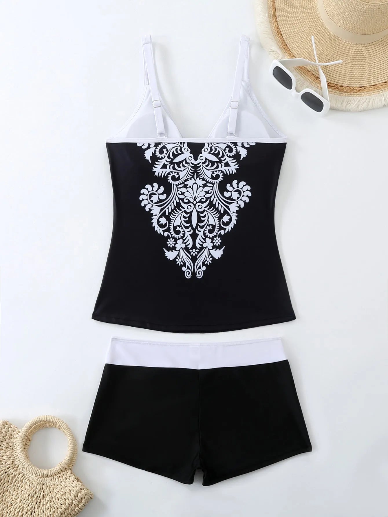 Plus size women's printed swimsuit briefs in black or rose red with matching trunks.