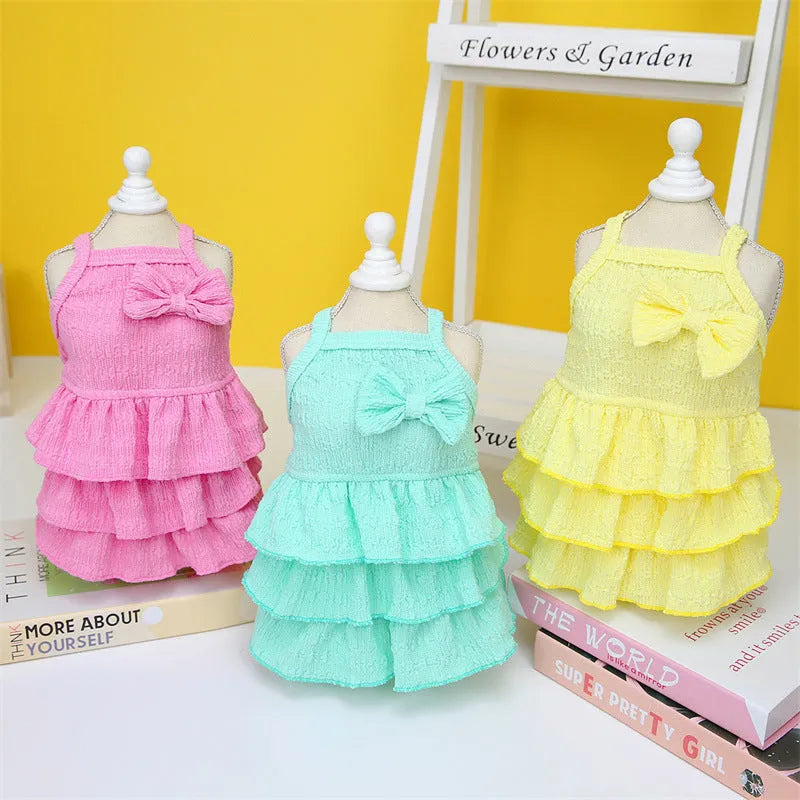Small dog wearing princess dress with candy layered skirt in rose red colour, designed for thin teddy bichon breeds