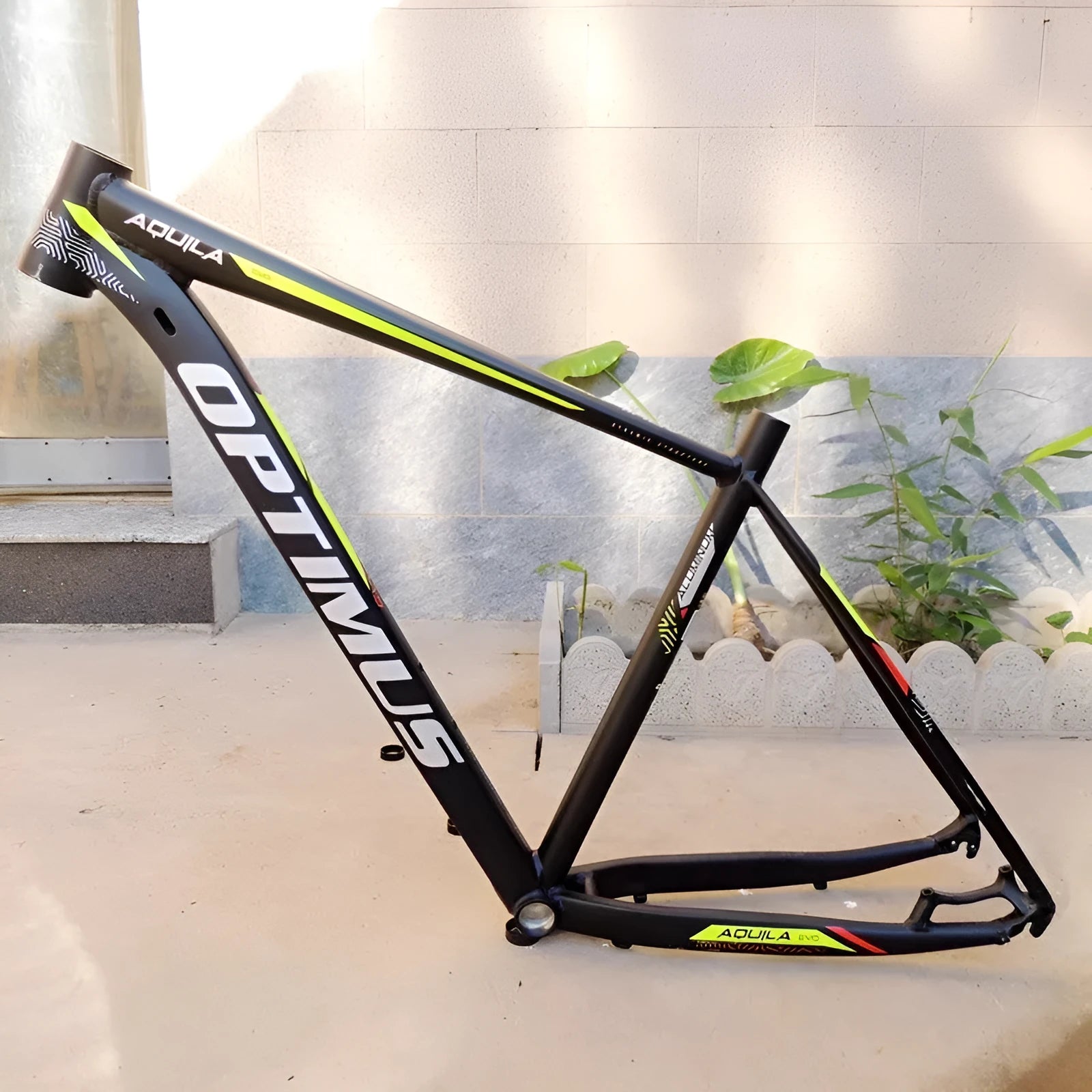 Black green 29-inch aluminium mountain bike frame with disc brake mount and internal cable routing ports.