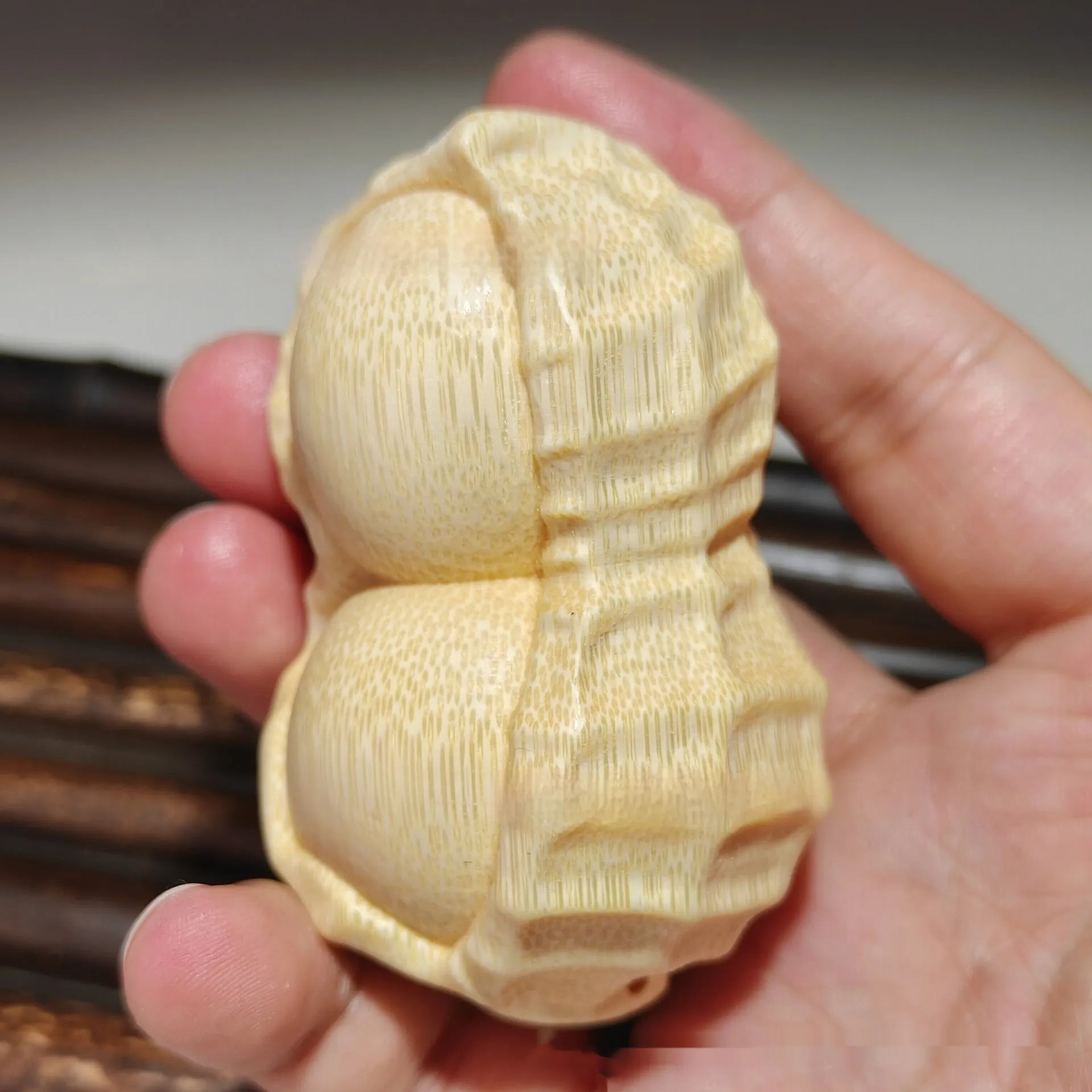 Modern minimalist solid bamboo carving peanut ornament symbolising good fortune