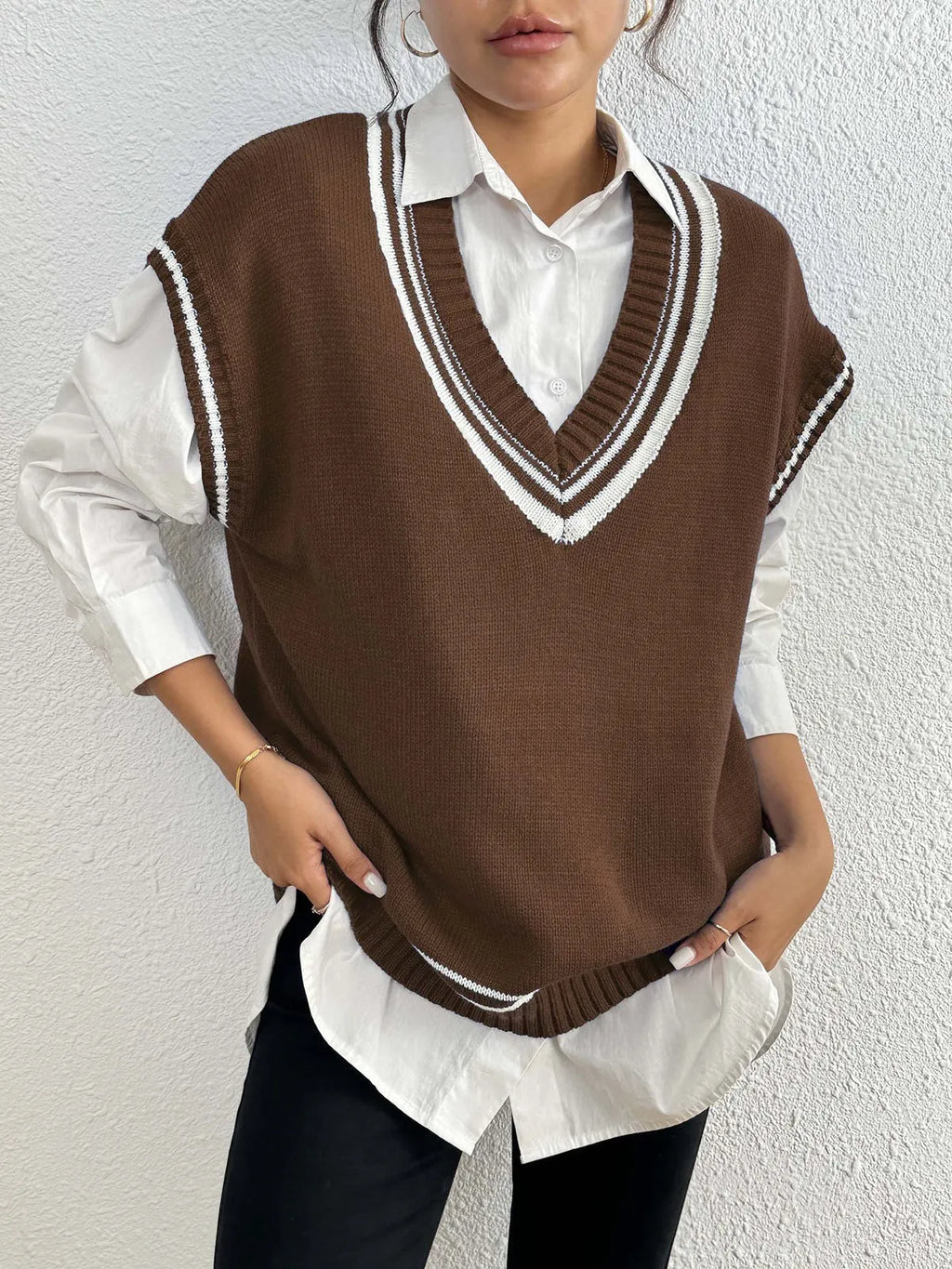 Women's loose fit college style vest sweater in blue, coffee, or black colour.